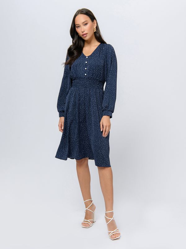 Blue polka dot midi length dress with wide elastic band at the waist