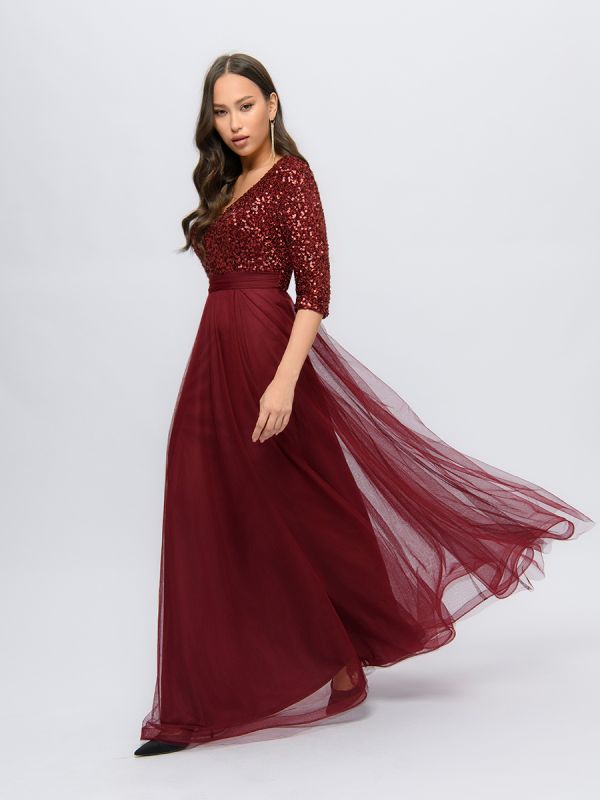 Wine colored maxi length dress with deep neckline and puffy skirt