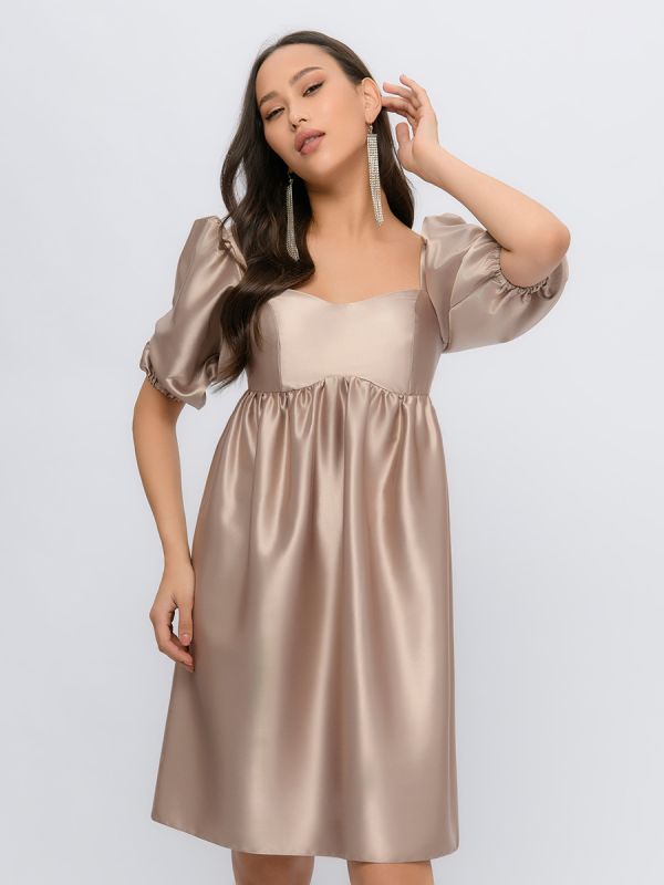 Beige mini length dress with 3/4 sleeves and shaped neckline