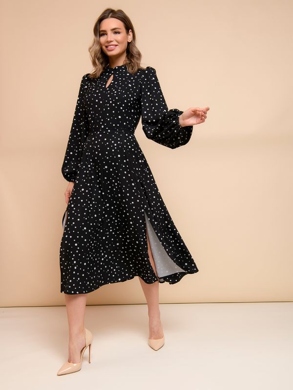 Black polka dot midi dress with voluminous sleeves and slit