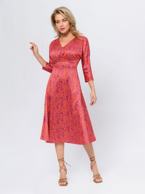 Orange colored midi length dress with print and V-neckline