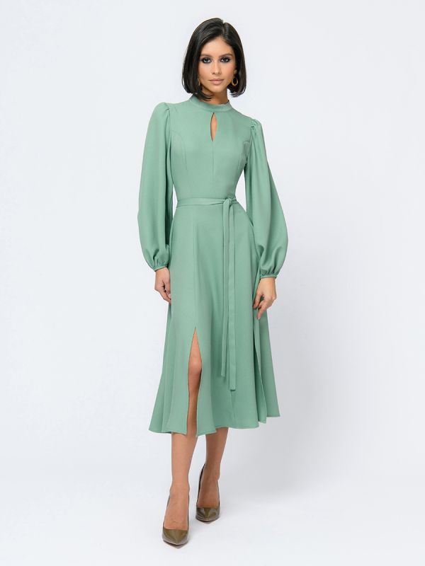 Pistachio colored midi length dress with voluminous sleeves and slit