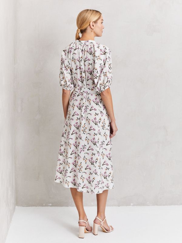 White printed midi length dress with voluminous sleeves and stand-up collar