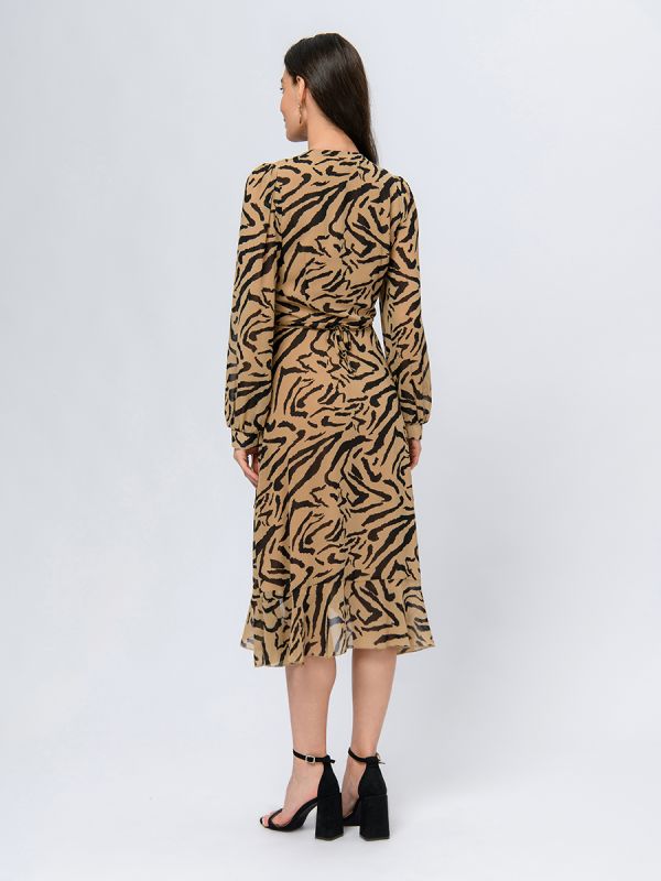 Beige colored midi length dress with animalistic print