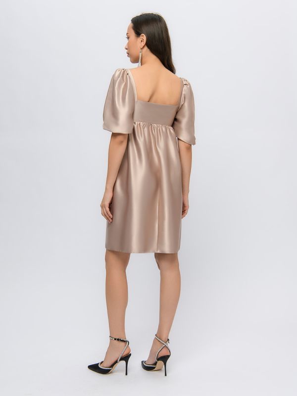 Beige mini length dress with 3/4 sleeves and shaped neckline