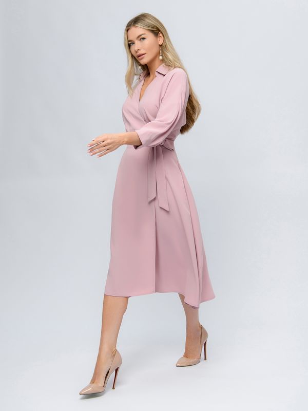 Pink colored midi length dress with a flare and 3/4 sleeves