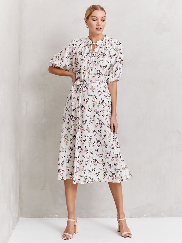 White printed midi length dress with voluminous sleeves and stand-up collar