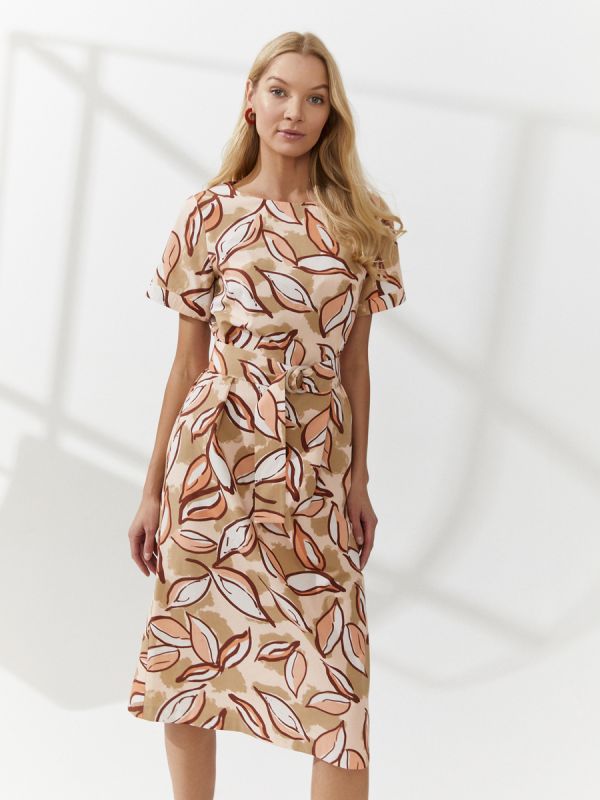 Peach colored dress with midi length print and waistband