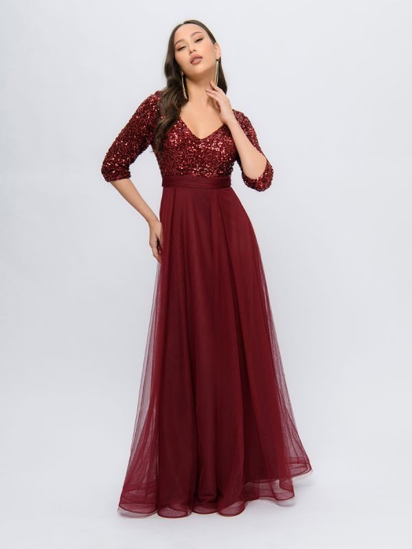 Wine colored maxi length dress with deep neckline and puffy skirt